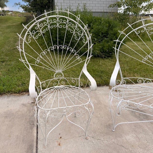 A wonderfully dramatic vintage garden set featuring two peacock chairs and matching peacock settee, crafted in the iconic...