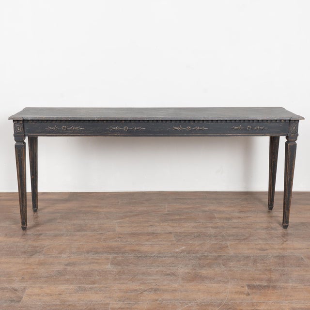 Swedish Gustavian-style black painted console table, a well-crafted reproduction in the timeless Scandinavian tradition....