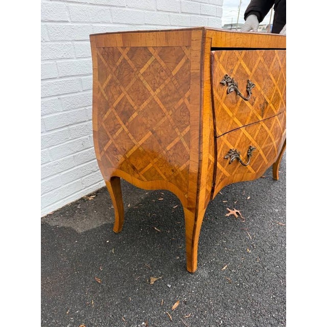 Vintage Italian Rococo Style Burl Wood Marquetry Commode with Cabriole Legs wood craftsmanship with geometric marquetry...
