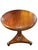 Round traditional-style occasional table crafted with a warm cherry or mahogany wood finish, featuring a molded circular...
