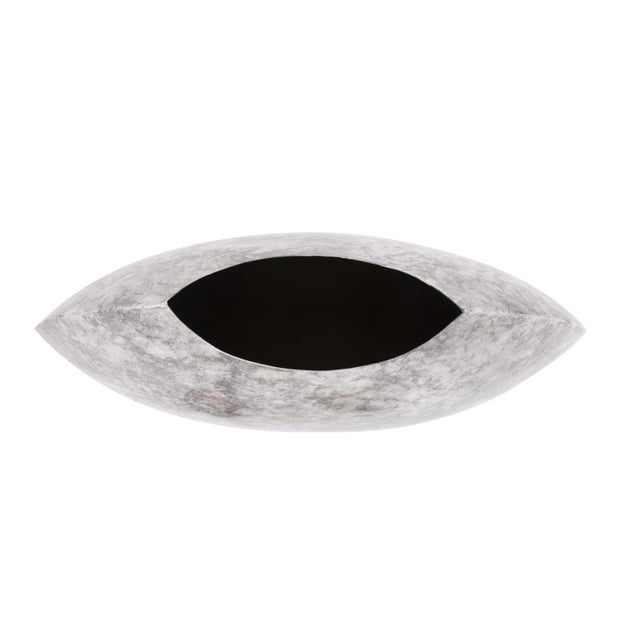 This unique vase features a flat, disc shape. The modern shape shows off the rich, gray and white marbled finish. Pair...