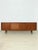 Stylish mid-century sideboard made of high-quality teak, designed by Gunni Omann and manufactured by Axel Christiansen...