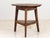 This charming 19th-century fruitwood English cricket or pub table exudes antique appeal. Its round top is supported by...