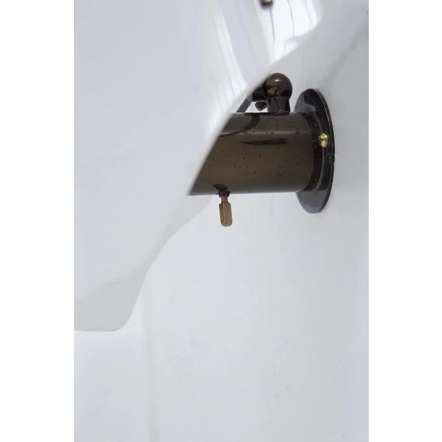 Peculiar and rare wall sconce designed by Gino Sarfatti for the fine Italian manufacture, dating from the 1960s. The base...