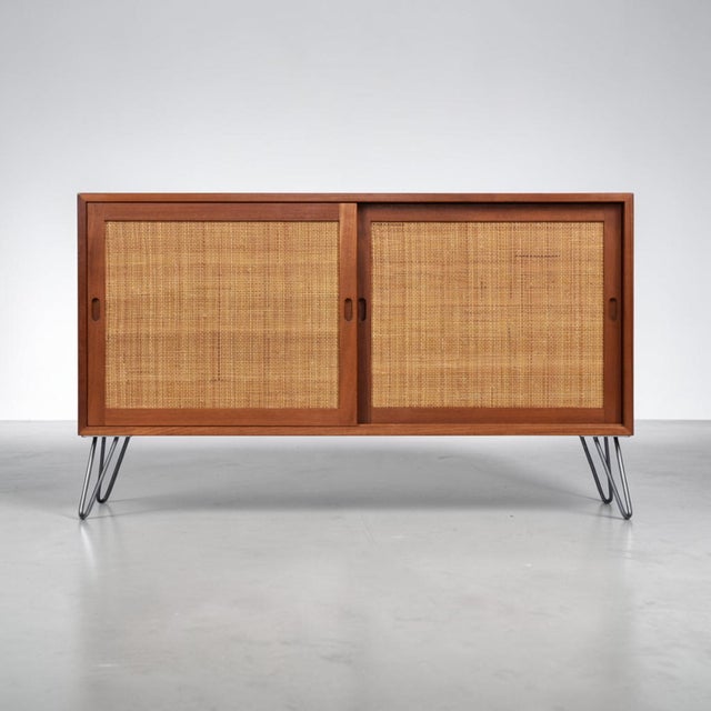 Extraordinarily unique teak cabinet Borge Mogensen teak cabinet. The warm, golden wheat colored caning makes this Borge...