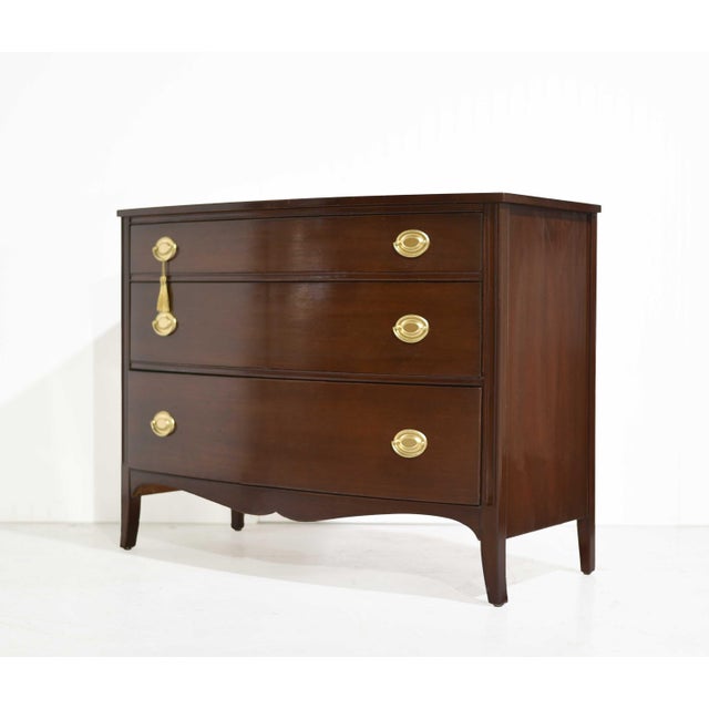 This mid century Federal-style chest features a gently curved front in rich mahogany, bringing warmth and subtle movement...