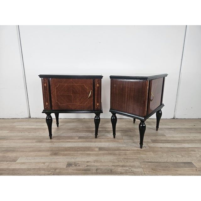 An elegant pair of vintage mahogany burl-covered bedside tables dating back to the 1960s, characterized by refined...