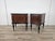 An elegant pair of vintage mahogany burl-covered bedside tables dating back to the 1960s, characterized by refined...