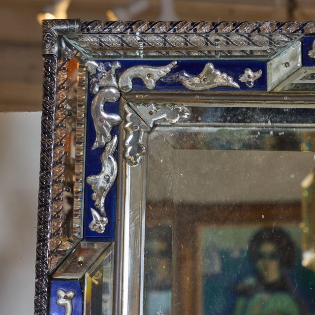 Elaborate cobalt glass mirror with twisted glass roping and metal corners. Original mirror has some light, age-appropriate...