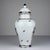 Vintage porcelain ginger jar with flower decorations made in Limoges, France in the 1970s. Hand-painted and gold borders....
