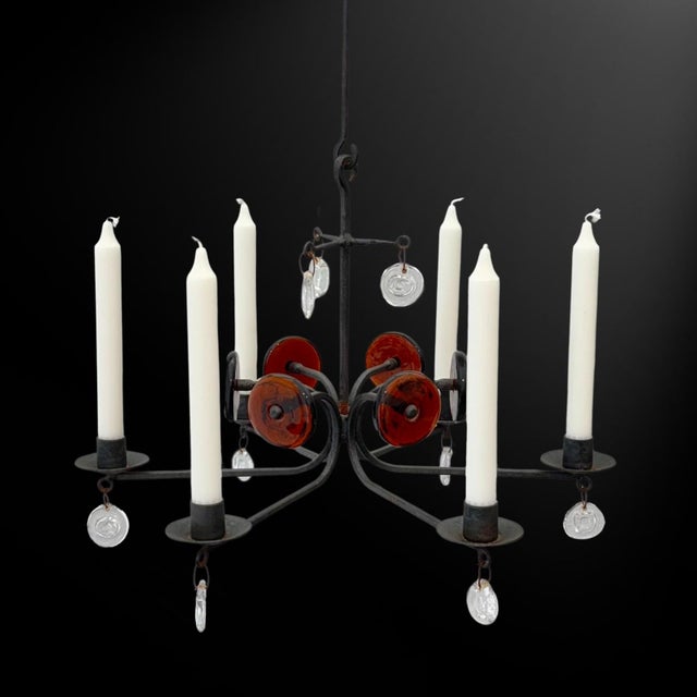An elegant chandelier model SH9 crafted from iron and glass, designed by Swedish artist Erik Höglund for Boda Smide....