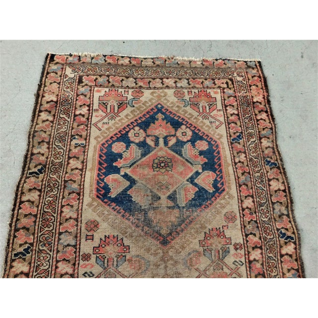 Double geometric medallion on beige background within floral decorated border. 3'2"x 6'3" Wool pile on cotton foundation....