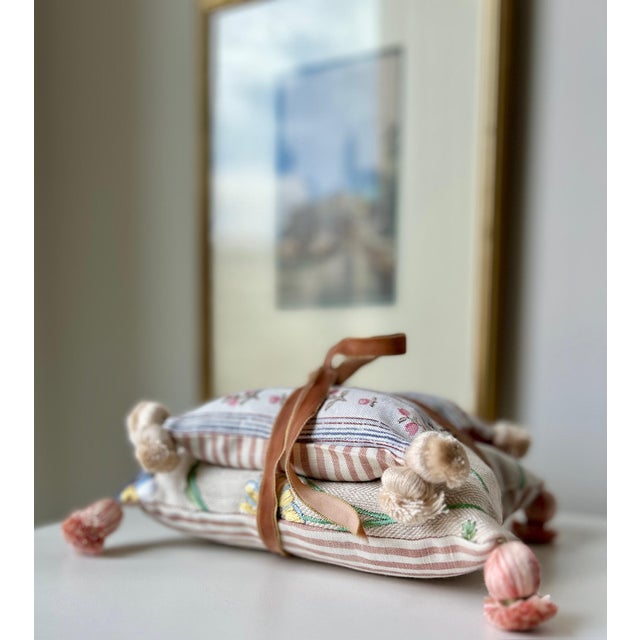 A collection of two decorative pillows filled with fragrant dried lavender, one small and the other large. Pretty enough...