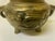 This 19th-century Chinese tripod censer is a beautiful example of late Qing Dynasty metalwork. Cast in solid bronze, the...
