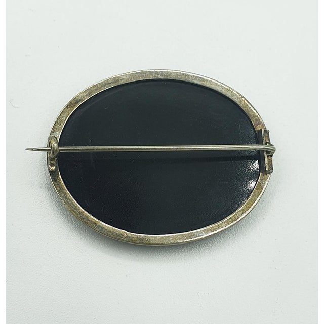 Old Brooch In Micromosaic representing the Pliny's Doves (villa Adriana, Tivoli). Old oval brooch made of onyx with glass...