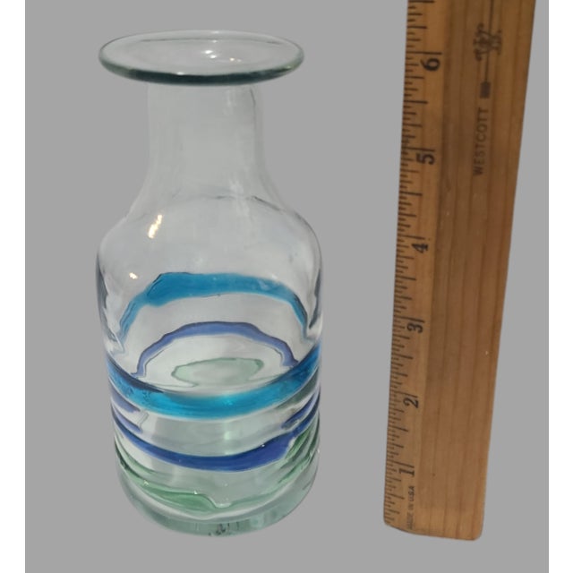 Elevate your space with a touch of artisanal beauty. This Vintage Hand-Blown Art Glass Ribbed Carafe Bottle Vase is a...