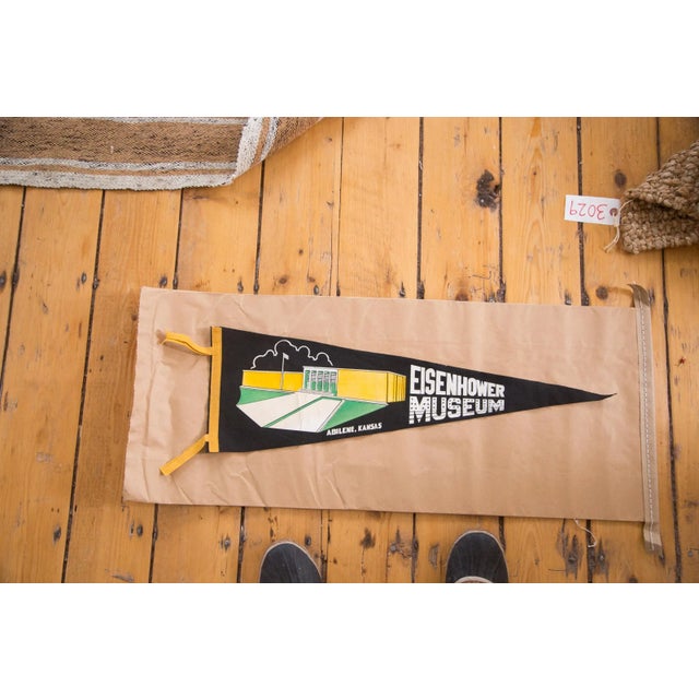 This is a vintage Eisenhower Museum Abilene, Kansas felt flag. Has graphic featuring the likeness of the museum itself...