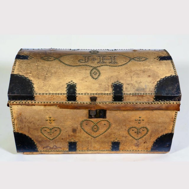 A wonderful domed-top travel trunk, probably late 19th to early 20th century, in the victorian vernacular saddler...