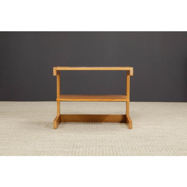 This rare and early (circa 1949) open-sided tiered side / end table by Vladimir Kagan, during his early years either right...