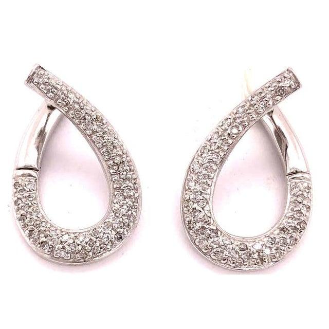 14Kt White Gold Latch Back Earrings with .50 Total Diamond Weight. Total Gold Weight 5.6 Grams.