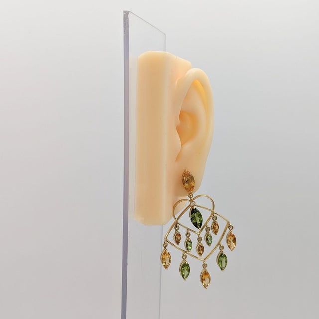 Beautiful chandelier earrings with 19.00 ct. of citrines and peridot marquise shapes with 0.05 ct. white diamond rounds....