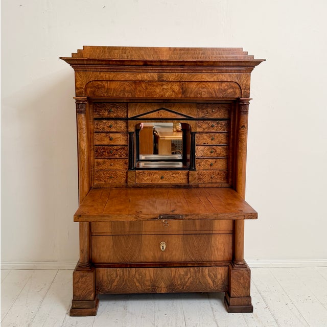 This elegant 19th century Biedermeier secretary is crafted in beautifully figured walnut veneer and showcases the refined...