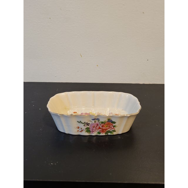 Beautiful, hand painted soap dish. Elevate your powder room with this rare piece. Features flowers with gilt detailing....