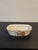 Beautiful, hand painted soap dish. Elevate your powder room with this rare piece. Features flowers with gilt detailing....