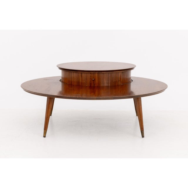 Mid-Century Modern Mahogany Circular Cocktail Table, with circular top tier having slide cabinet on four tapered legs with...