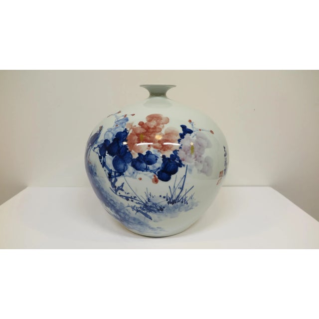 Artisan porcelain hand formed high quality fine porcelain. Wonderful shape with Indigo painting. Artist signed with poem....
