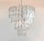 An impressive Italian Murano glass chandelier featuring a dramatic four-tier design with 80 large clear square prism tubes...
