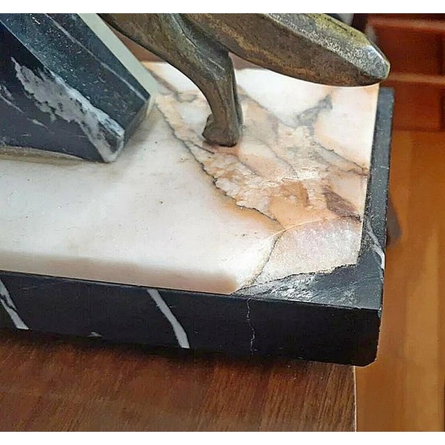 Circa 1925 Art Deco tri-color French marble RUNNING clock with matching garnitures, matching bronzes foxes either side and...