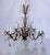 Decorative vintage Spanish style brass chandelier with hand cut faceted glass spears and Swedish cut crystal prisms. The...