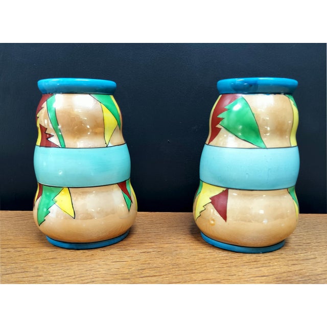 Colorful pair of 1950's hand-painted geometric vases made by Gold Castle Chikusa Japan. Bright geometric patterns over...