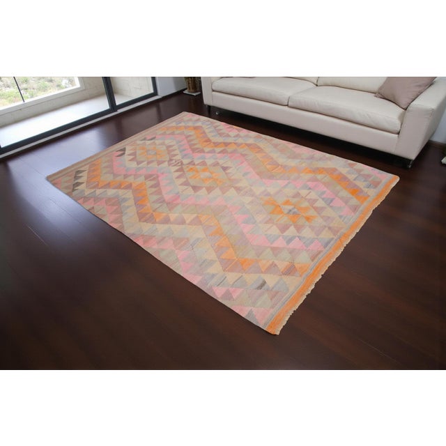 Vintage 1960s Turkish Antalya kilim, handwoven with soft pastel vegetable-dyed wool. Geometric triangle motifs in sun-...