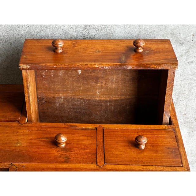 A Japanese solid wood Kaidan Tansu, dating from the first half of the 20th century. This traditional stairwell cabinet...