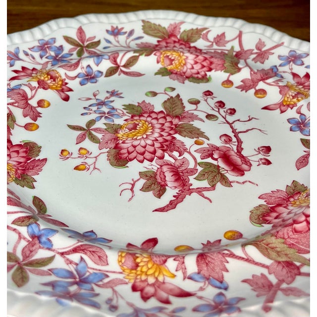 Gadroon shape with cool blue and red floral tones on a cream background. C. 1926-1985.