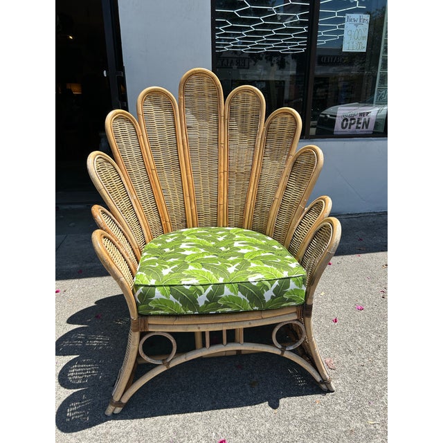 Impressive vintage Boho chic fan back chair, crafted in bamboo and wicker in a dramatic modern style. Includes a thick...