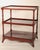Pair of English Regency style mahogany 3 tier end tables, circa 1920. The top with a raised side and back gallery, 3...