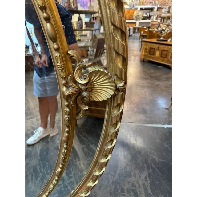 Wood 19th Century Large Scale French Oval Carved and Giltwood Mirror For Sale - Image 7 of 11