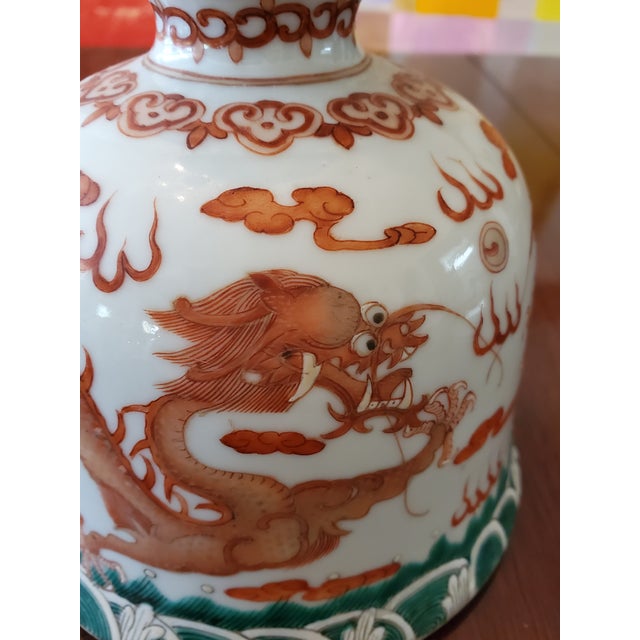 A fine vintage Chinese porcelain hand painted vase with five clawed dragons. Rich raised enamel decorations with ferocious...