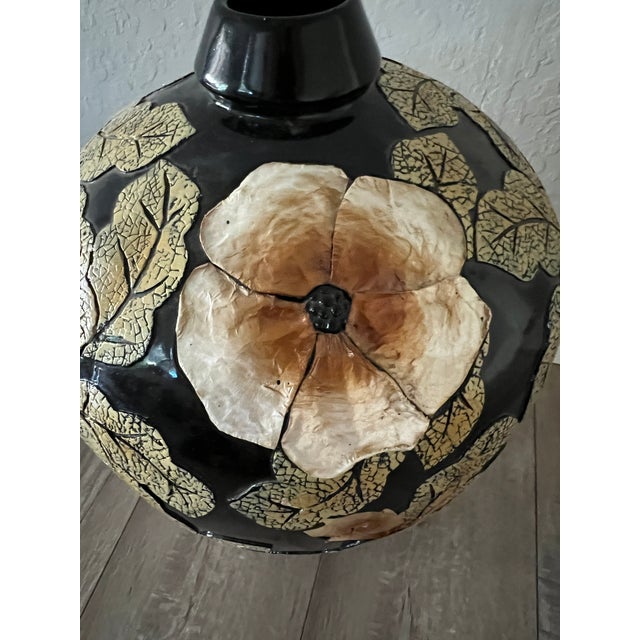 Decorative meiping-form black vase with applied leaf and flower relief, unmarked decorative import. Good vintage condition.