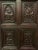 Solid oak storage unit Three small panels decorated with human heads. Paneled sides. Interior with shelves and drawers....