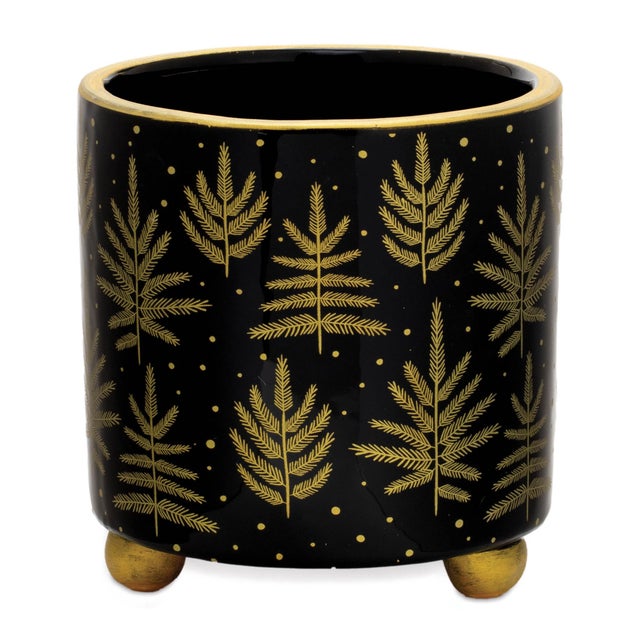 Elevate your holiday decor with the Footed Pine Tree Planter set. These stunning containers come in two sizes and feature...