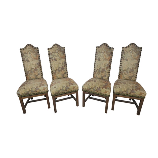 A set of four high-backed Historismus chairs made in Italy in the 19th century. The frames are of solid oak with straight...