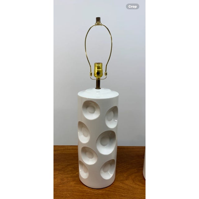 Really cool pair of MCM white ceramic table lamps. The Swiss Cheese type style is something that immediately came to mind...