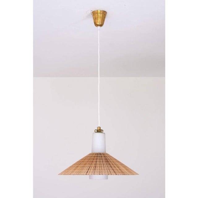 This rare pendant was designed by paavo tynell and produced by idman in finland. Model k3-43, it was introduced in the...