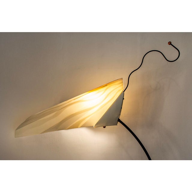 Floor lamp with metal frame and folded plastic diffuser. Sister model Designer: Riccardo Dalisi Manufacturer: Oluce Year:...