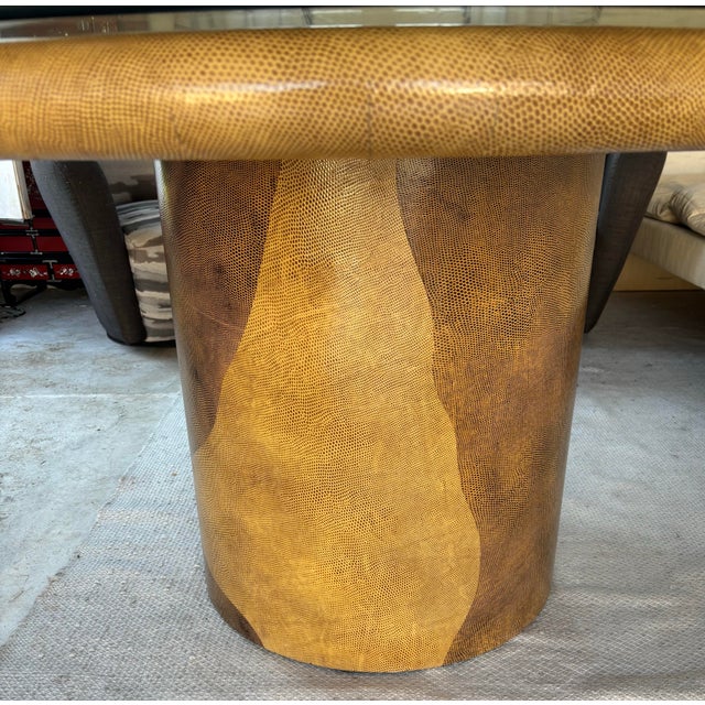 This is a bespoke Karl Springer-attributed Round Dining Or Center Table, covered in Taupe Lacquered Snakeskin or Snake-...