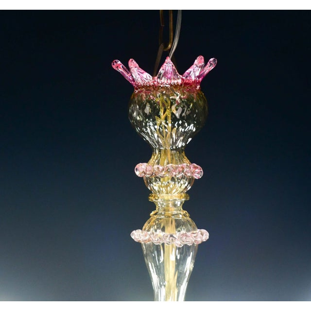 Pretty Murano chandelier, typical classic Venetian color pink and gold. The chandelier has 5 arms that mount 5 e14 light...